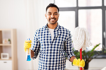 Image showing indian man with mop and detergent cleaning at home