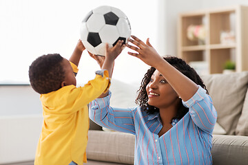 Image showing mother and baby playing with soccer ball at home