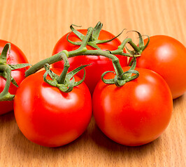 Image showing Freshly picked red tomatoes on a table top 