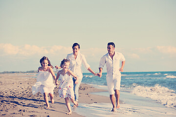 Image showing happy young  family have fun on beach