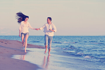 Image showing young couple  on beach have fun