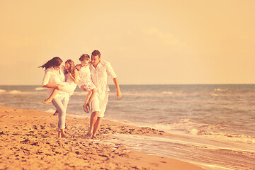 Image showing happy young  family have fun on beach