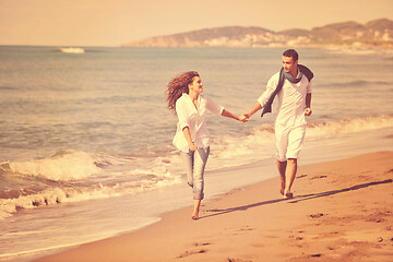 Image showing happy young couple have fun at beautiful beach