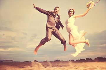 Image showing romantic beach wedding at sunset