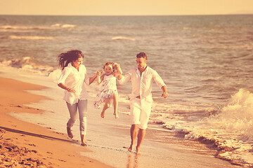 Image showing happy young  family have fun on beach