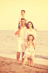 Image showing happy young family have fun on beach