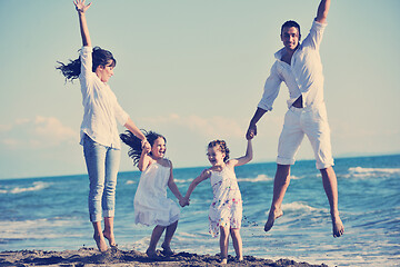 Image showing happy young  family have fun on beach