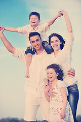 Image showing happy young family have fun on beach