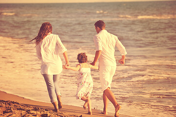 Image showing happy young  family have fun on beach