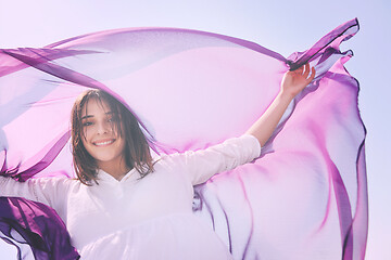 Image showing beautiful young woman on beach with scarf