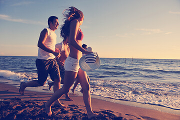 Image showing people group running on the beach