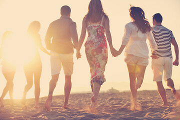 Image showing happy young  people group have fun on beach