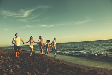 Image showing people group running on the beach