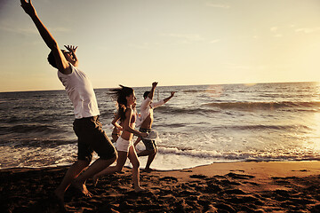 Image showing people group running on the beach