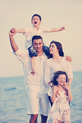 Image showing happy young family have fun on beach