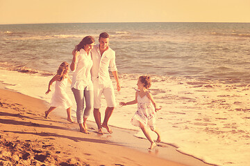 Image showing happy young  family have fun on beach