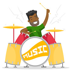 Image showing Young african-american man playing on drum kit.