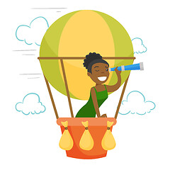 Image showing African-american woman flying in hot air balloon.