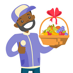 Image showing African delivery courier delivering fruit basket.