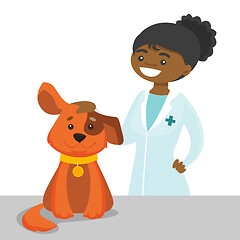 Image showing African-american veterinarian doctor examining dog