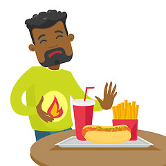 Image showing Sad african-american man suffering from heartburn.