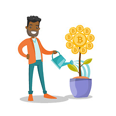 Image showing Businessman watering flower with bitcoin symbol