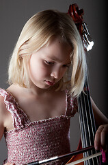 Image showing Portrait of a young teenager girl in studio with a cello