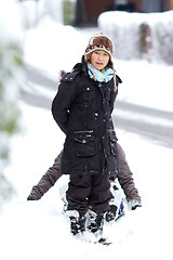 Image showing Girl playing in the snow in winter in denmark