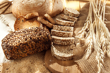 Image showing Gluten free food. Various pasta, bread and snacks on wooden background from top view