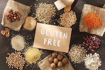 Image showing Gluten free flour and cereals millet, quinoa, corn bread, brown buckwheat, rice with text gluten free