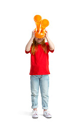 Image showing Full length portrait of cute little kid in stylish jeans clothes looking at toy binoculars