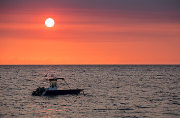 Image showing Sunset over Madagascar Nosy be beach with boat silhouette