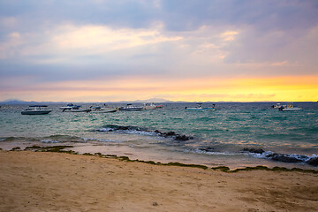 Image showing Sunset over Madagascar Nosy be beach with boat silhouettes