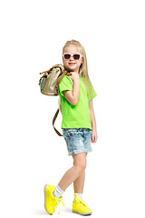 Image showing Full length portrait of cute little kid in stylish jeans clothes looking at camera and smiling