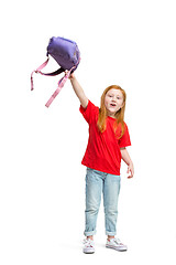 Image showing Full length portrait of cute little kid in stylish jeans clothes looking at camera and smiling