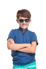 Image showing Full length portrait of cute little kid in stylish clothes looking at camera and smiling