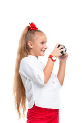 Image showing Full length portrait of cute little kid in stylish clothes with retro camera