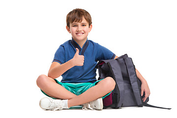 Image showing Full length portrait of cute little kid in stylish clothes looking at camera and smiling