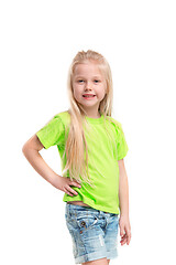 Image showing Full length portrait of cute little kid in stylish jeans clothes looking at camera and smiling