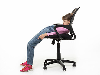 Image showing Girl ten years old funny got off the office chair
