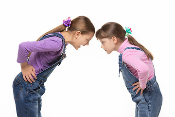 Image showing Girl yells at younger sister during altercation on white background