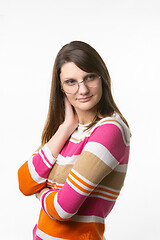 Image showing Portrait of a beautiful girl of European appearance in round glasses, looking to the side