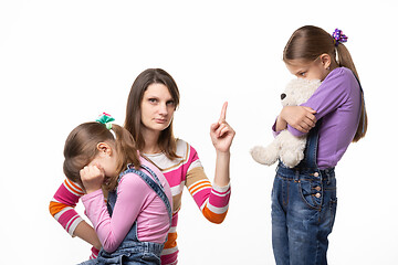 Image showing Mom talks hard with her daughter for offending her sister and looking in the frame