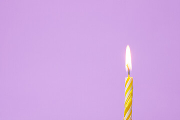 Image showing One festive candle is lit, light purple background