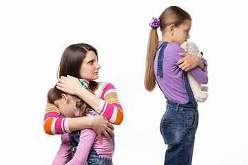 Image showing Mom scolds the eldest daughter who took the toy from the youngest