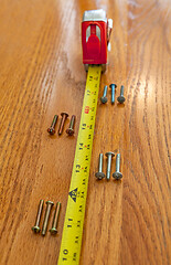 Image showing Screws and tape measure