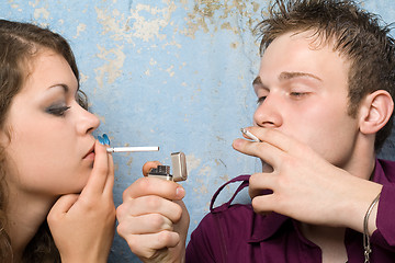 Image showing young couple with a cigarettes and a lighter 2