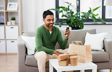 Image showing indian man using smartphone for food delivery