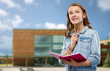 Image showing teenage student girl with notebook over school