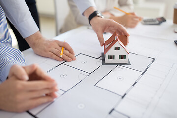 Image showing close up of architects discussing house project